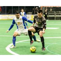 Syracuse Silver Knights and Missouri Comets Battle for Possession