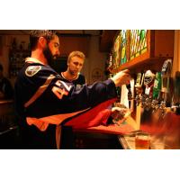 Elmira Jackals Ian Young and  Mark Bennett learn the proper beer pour