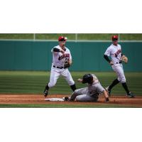 Indianapolis Indians second baseman Kevin Kramer throws to first