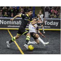 Jamie Thomas of the Baltimore Blast (right) attempts a tackle against the Milwaukee Wave