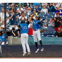 Jason Lopez and Pablo Olivares celebrate for the Tampa Tarpons