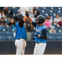 Michey Gasper and Diego Garcia celebrate for the Tampa Tarpons