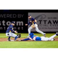 Malik Collymore of the Ottawa Champions steals second against the Quebec Capitales