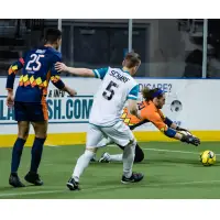 Tacoma Stars goalkeeper Danny Waltman scoops up a save as Mike Ramos battles St. Louis' Mike Scharf in front of the goal