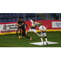 Tacoma Stars forward Vini Dantas (28) tries to split two Ontario Fury defenders as Philip Lund (8) looks on