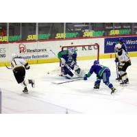 Brandon Wheat Kings defenceman Neithan Salame (left) takes a shot against the Swift Current Broncos