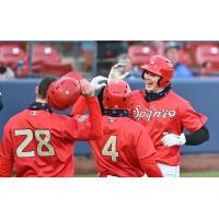 Spokane Indians exchange high fives at home plate