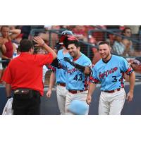 Spokane Indians catcher Daniel Cope (43) is congratulated by Kyle Datres (3) and others after a home run