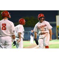 Spokane Indians infielder Kyle Datres reacts as he comes in to score