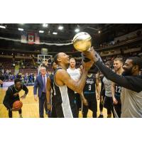 Billy White lifts the National Basketball League of Canada championship trophy with the Moncton Magic