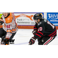 FORT WAYNE's MARK RASSELL and Indy Fuel's ALEX WIDEMAN in action