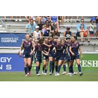 The North Carolina Courage celebrate after Tess Boade (#28) scores in the first half