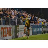 Pittsburgh Riverhounds SC center back Arturo Ordoñez celebrates with the crowd