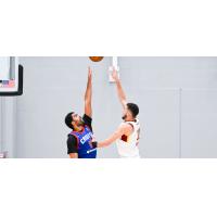 Cleveland Charge's Pete Nance and Motor City Cruise's Jontay Porter in action