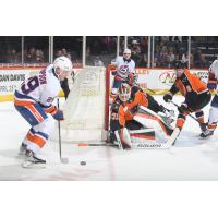 Bridgeport Islanders' Tyce Thompson and Lehigh Valley Phantoms' Parker Gahagen and Emil Andrae in action