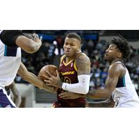 Cleveland Charge guard Dexter Dennis in heavy traffic