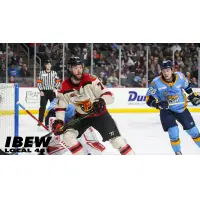 Indy Fuel's ZJonathon Martin and Toledo Walleye's Riley McCourt in action