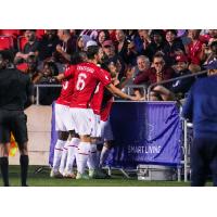 Cavalry FC celebrate a goal in front of the home fans