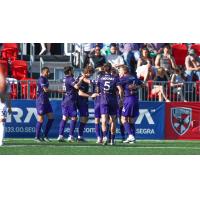 Louisville City FC celebrates Aiden McFadden's goal