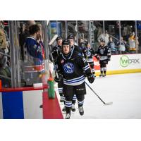 Miles Cooper (front) leads his Wenatchee Wild teammates on a victory lap