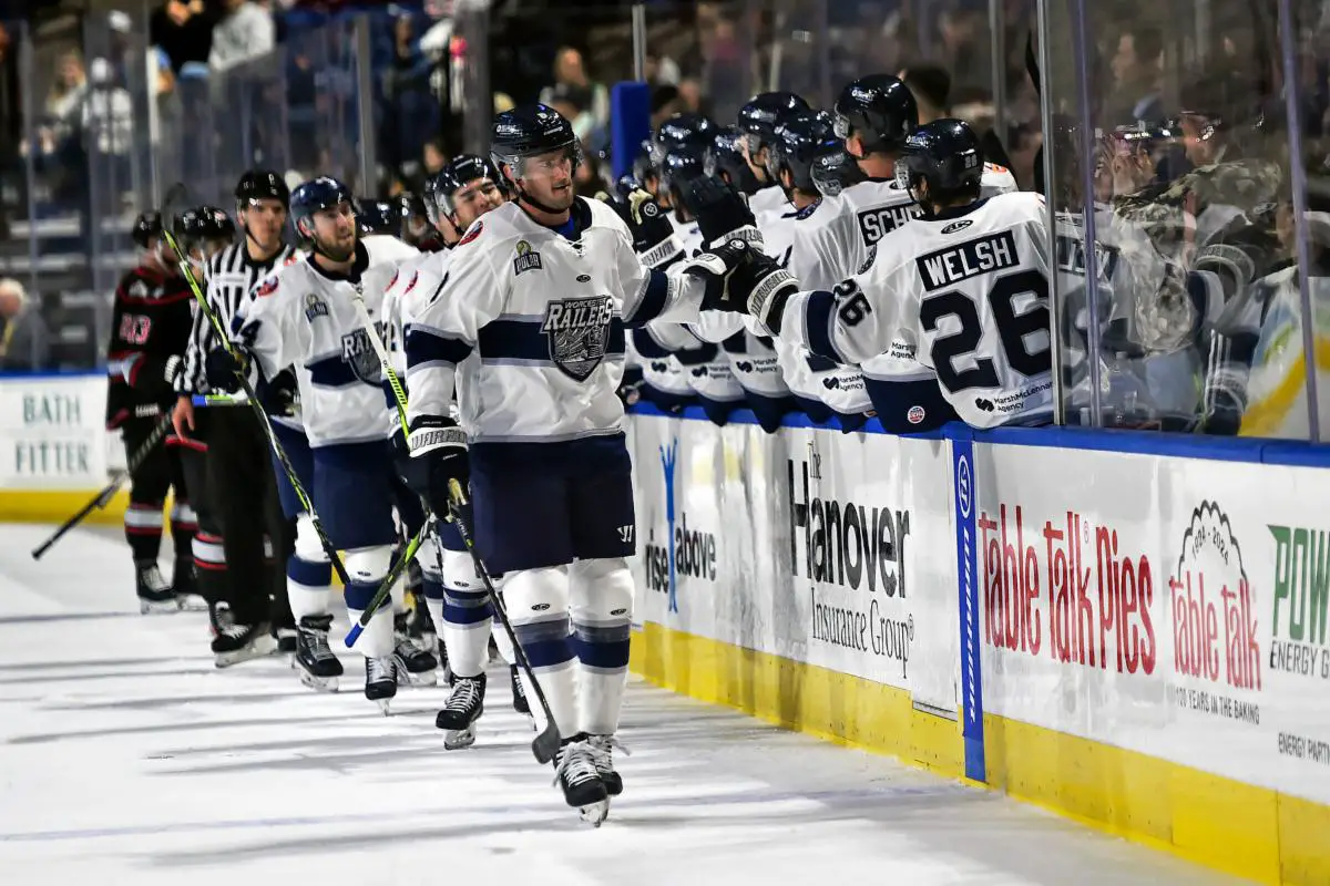 Worcester Railers exchange high fives along the bench October 23, 2023 Photo on OurSports Central