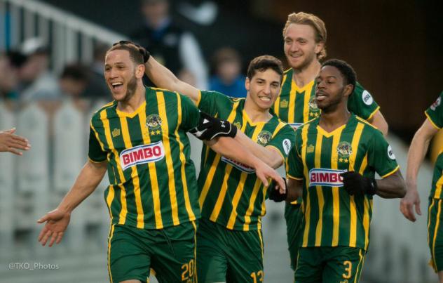 Rochester Rhinos Tony Walls (No. 20) Celebrates with Rochester Teammates