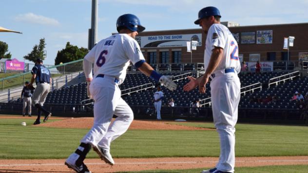 Calin Walsh of the Midland RockHounds is Congratulated after a Home Run