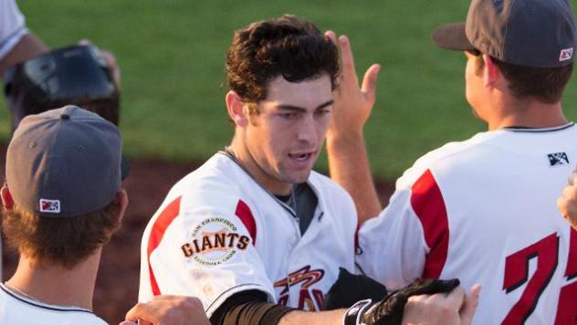 Ronnie Jebavy of the Salem-Keizer Volcanoes is Congratulated after a Homer