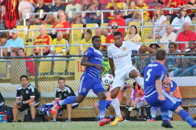 Fort Lauderdale Strikers Forward Stefano Pinho vs. FC Edmonton's Kareem Moses (12) and Albert Watson (5)