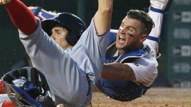 Buffalo Bisons Catcher Sean Ochinko's Attempts to Tag out Ricky Hague of the Syracuse Chiefs