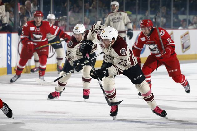 Pat Cannone (12) and Magnus Paajarvi (23) of the Chicago Wolves vs. the Charlotte Checkers