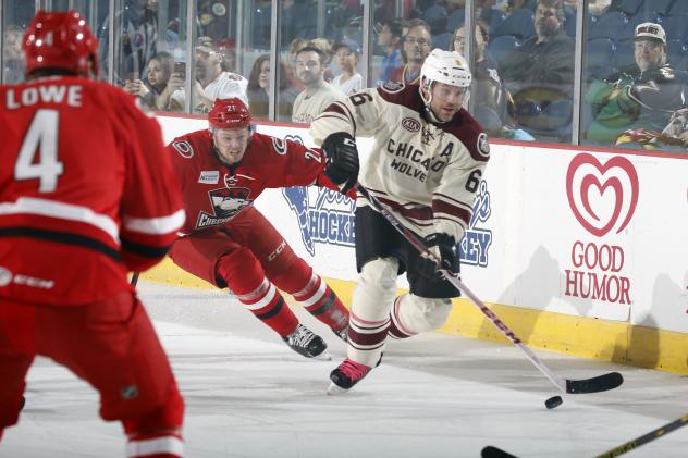 Andre Benoit of the Chicago Wolves Controls the Puck vs. the Charlotte Checkers