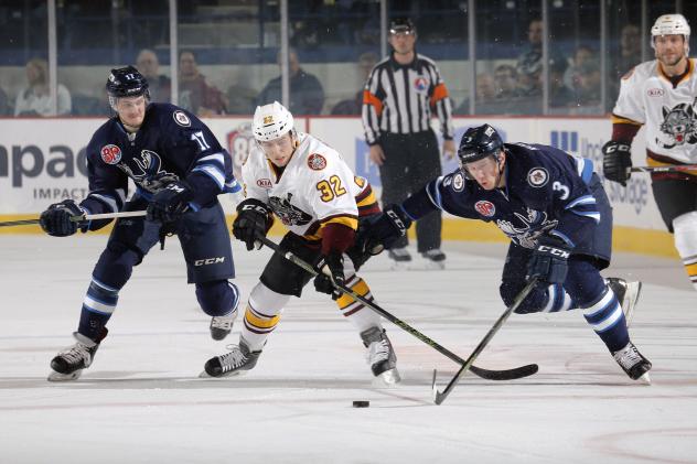 Ivan Barbashev of the Chicago Wolves Battles the Manitoba Moose