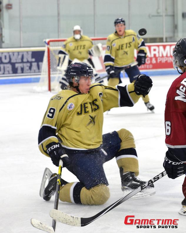 Nils Rygaard of the Janesville Jets Tries to Corral the Puck