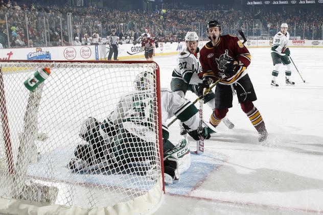 Justin Hodgman of the Chicago Wolves Reacts to a Shot vs. the Iowa Wild