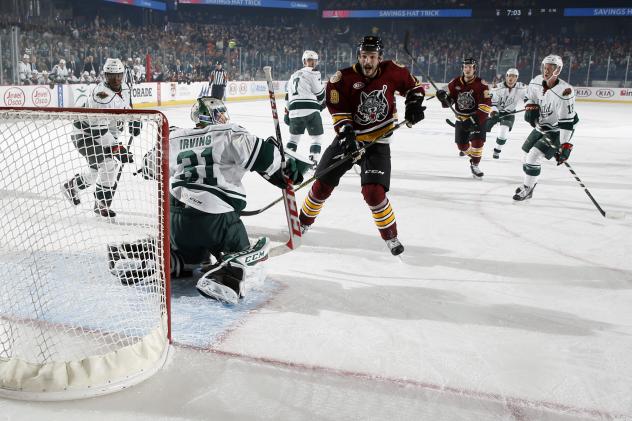 Justin Hodgman of the Chicago Wolves Takes a Shot vs. the Iowa Wild