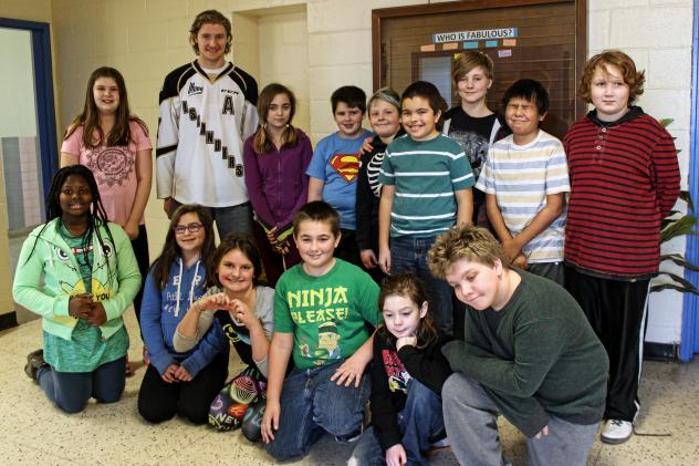 Charlottetown Islanders forward Oliver Cooper with Prince Street School Students