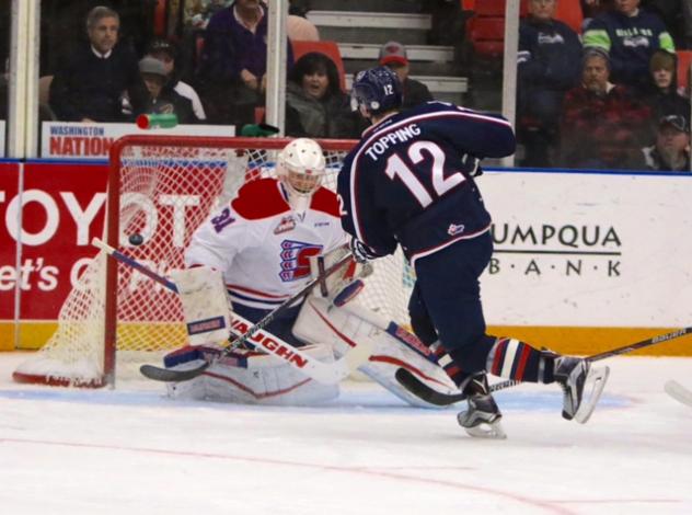 Jordan Topping of the Tri-City Americans Shoots on the Spokane Chiefs