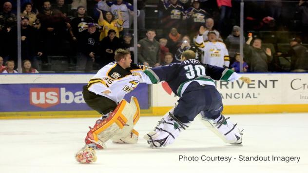Goaltenders Kris Lazaruk of the Colorado Eagles and Anthony Peters of the Florida Everblades Battle