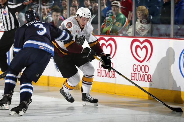 Jordan Caron of the Chicago Wolves Battles Past the Manitoba Moose