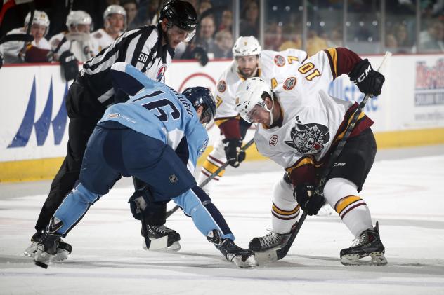 Zach O'Brien of the Chicago Wolves Faces off with the Milwaukee Admirals