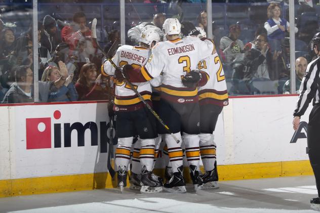 Chicago Wolves Celebrate a Goal against the Boards vs. the Texas Stars