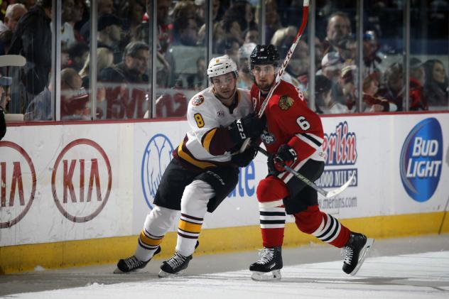 Chicago Wolves RW Ty Rattie Pushes for Space vs. the Rockford IceHogs