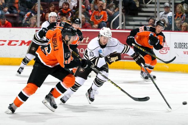 Aaron Palushaj of the Lehigh Valley Phantoms Races the Hershey Bears for the Puck