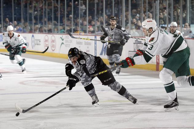 Chicago Wolves RW Zach O'Brien Reaches for the Puck vs. the Iowa Wild