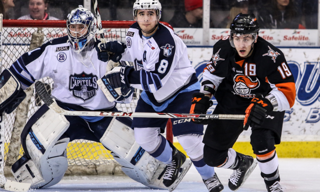 Omaha Lancers Forward Brian Williams Sets up in Front of the Madison Capitols Net