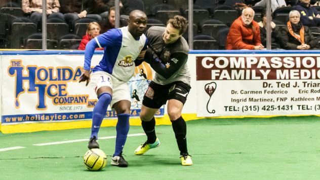 Syracuse Silver Knights Try to Outmuscle the Missouri Comets for the Ball