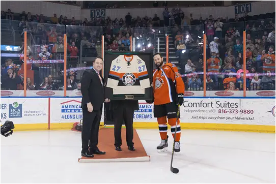 Brent Thiessen Presents Andrew Courtney of the Missouri Mavericks with a Commemorative Jersey