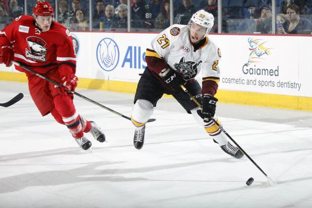 Chicago Wolves RW Jordan Caron Prepares to Pass the Puck vs. the Charlotte Checkers