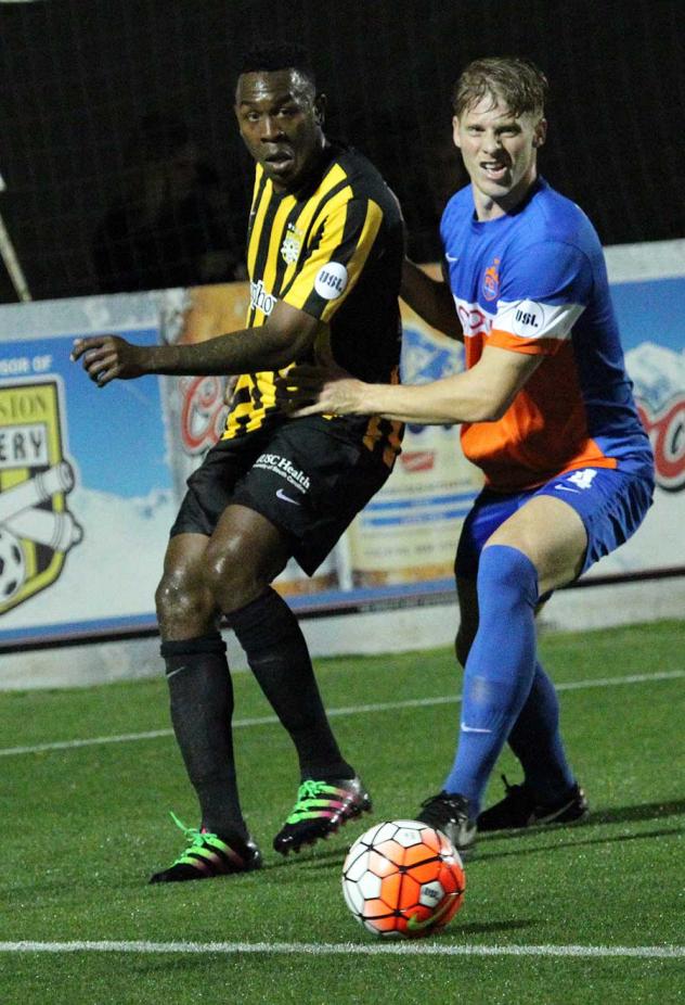 Charleston Battery and FC Cincinnati Race for the Ball